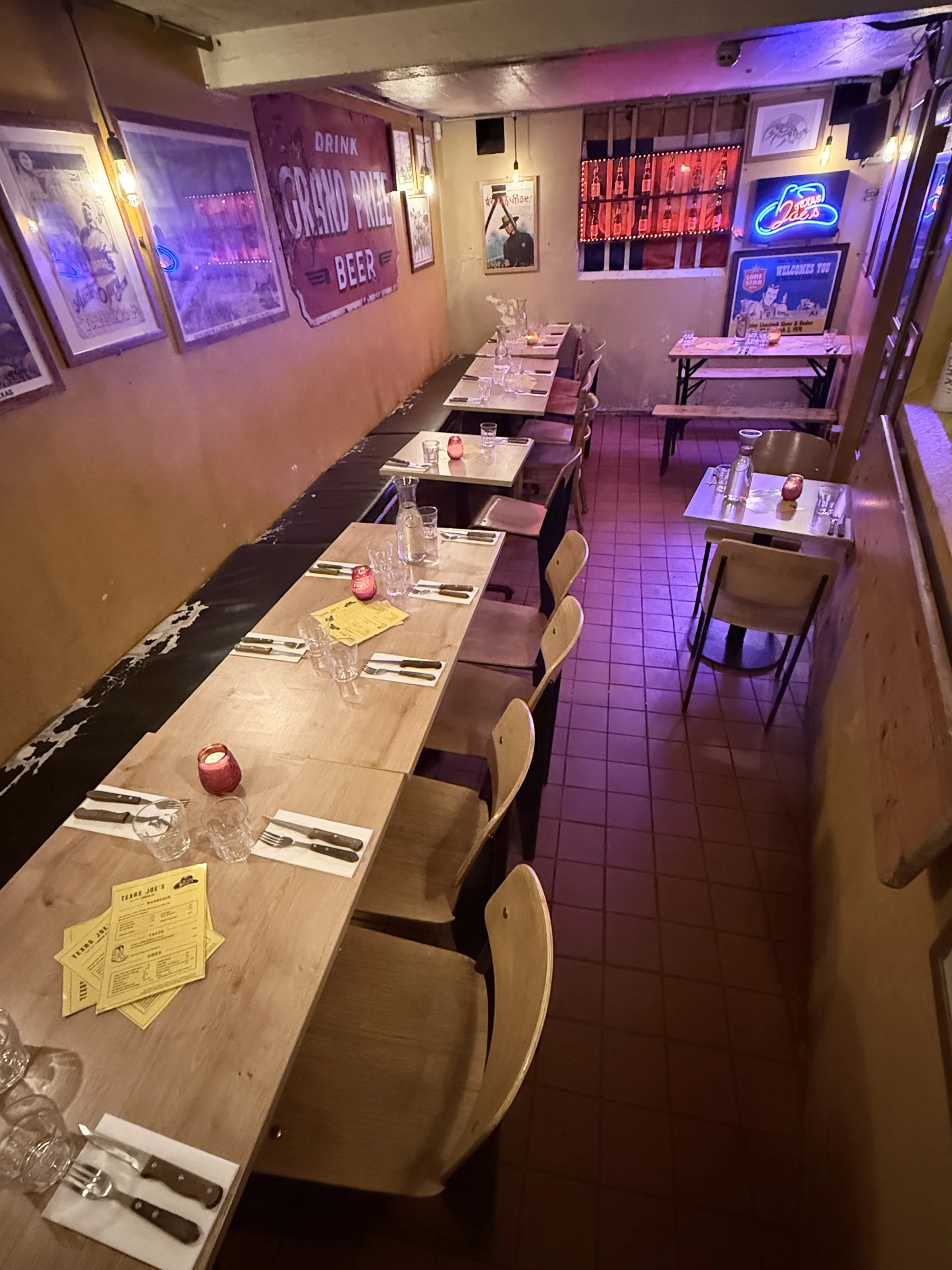 The Flying W dining room, with its historic Texas beer bottle display mounted on the far wall