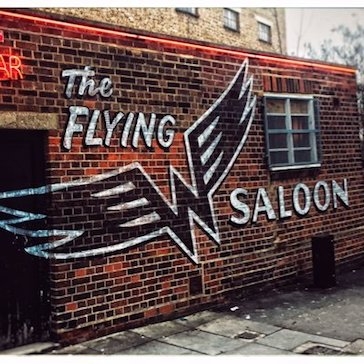 The Flying W Saloon painted sign