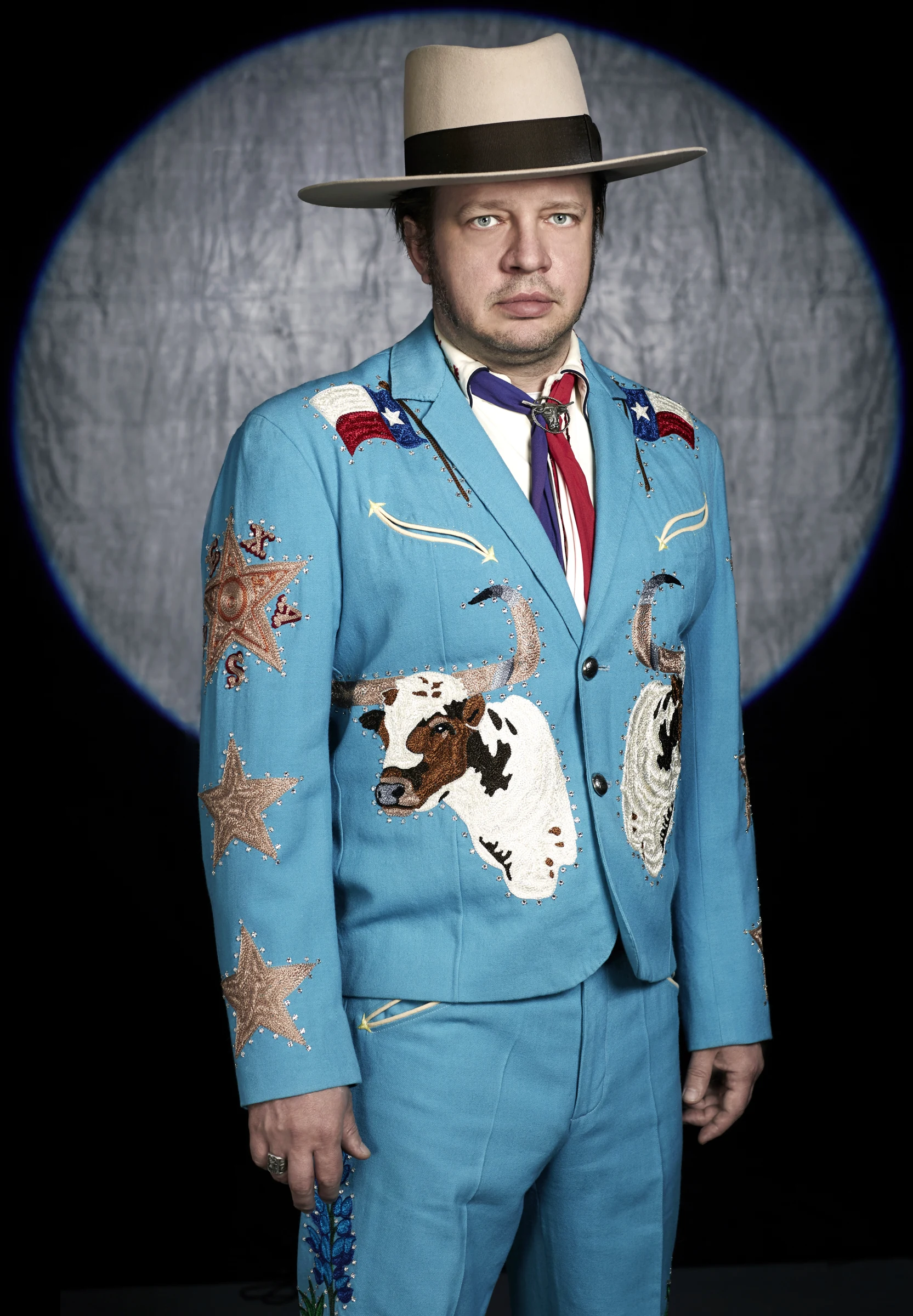 Joe in his embroidered blue Western suit and cowboy hat