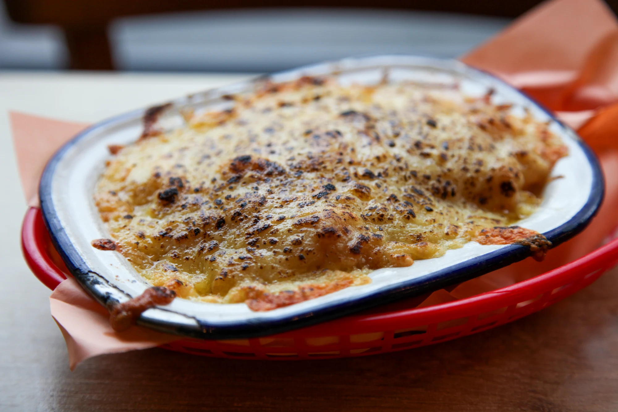 Baked macaroni and cheese in an enamel dish