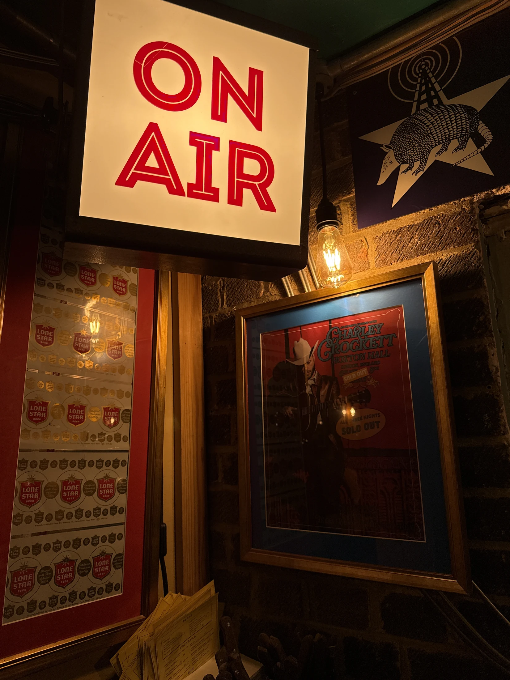 On Air sign and Texas Radio armadillo artwork in the Flying W