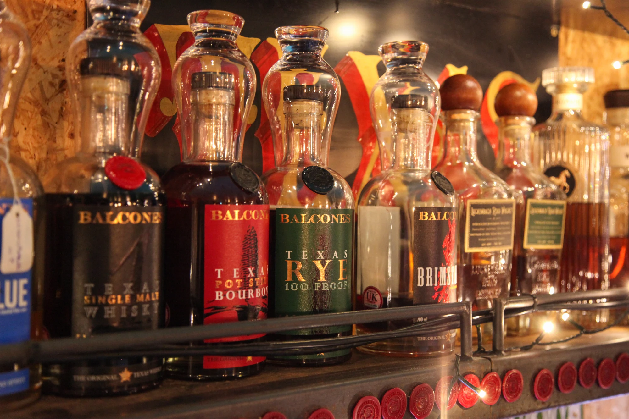 Texas whiskey bottles on the bar